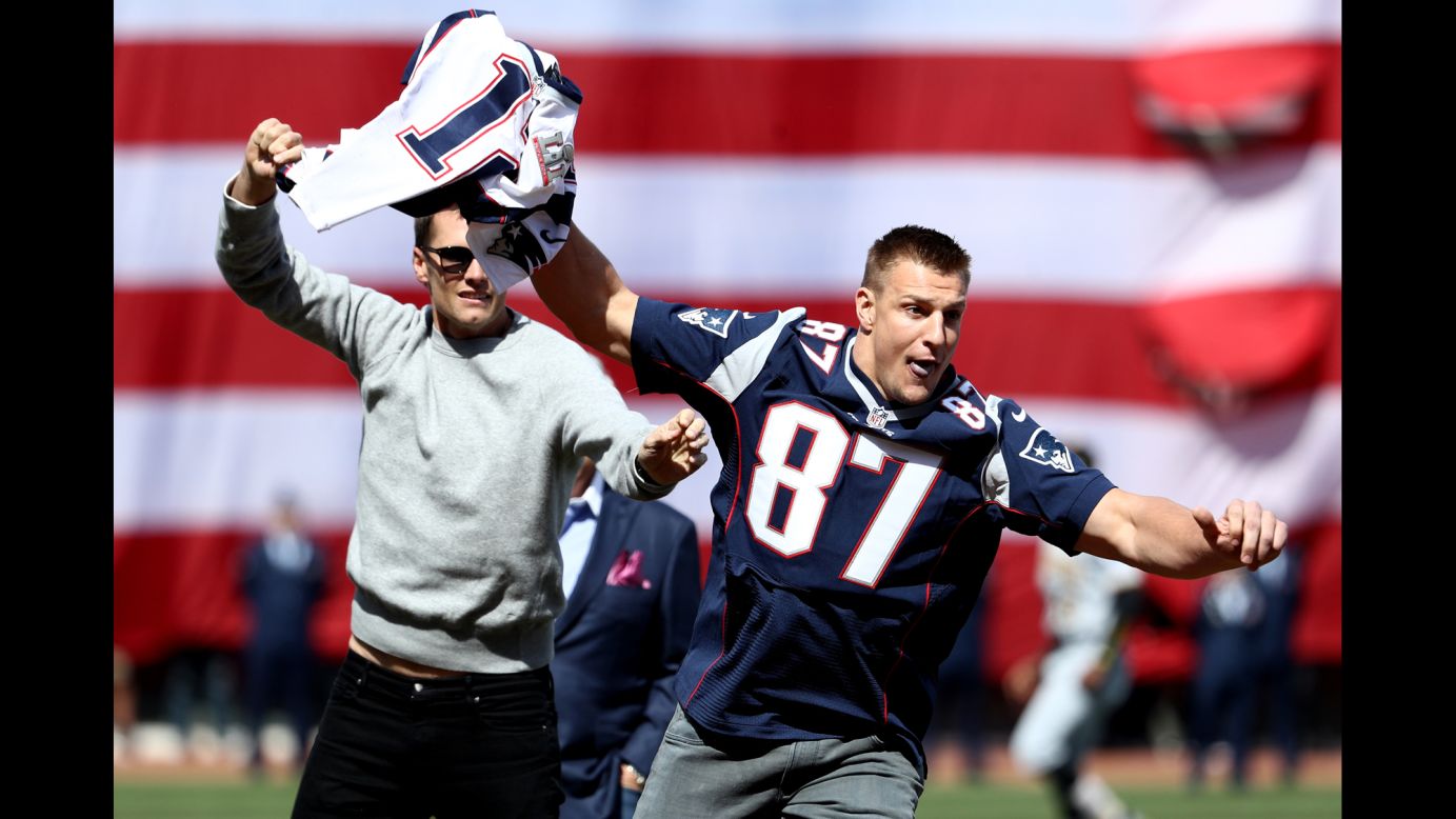 New England Patriots tight end Rob Gronkowski runs off with the Super Bowl jersey of teammate Tom Brady during the Opening Day ceremonies of the Boston Red Sox on Monday, April 3. The playful bit came after Brady's jersey had been stolen for real <a href="http://www.cnn.com/2017/03/20/sport/tom-brady-stolen-super-bowl-jerseys-recovered/" target="_blank">and recovered in Mexico.</a>