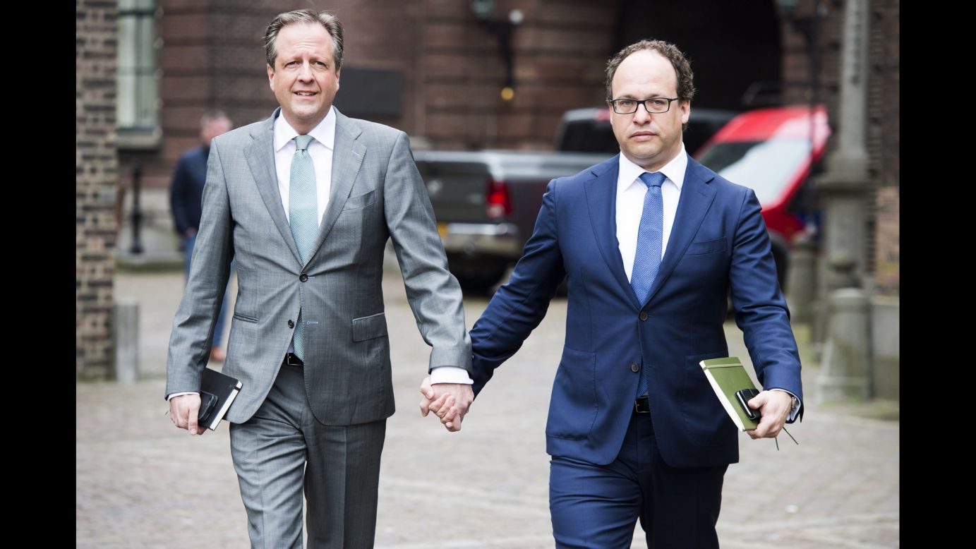 Dutch politicians Alexander Pechtold, left, and Wouter Koolmees hold hands as they arrive for a meeting in The Hague, Netherlands, on Monday, April 3. Across the world, many Dutch citizens have been posting images of themselves on social media with the hashtag #allemannenhandinhand (all men, holding hands). <a href="http://www.cnn.com/2017/04/05/europe/men-holding-hands-netherlands/" target="_blank">The trend started</a> after reports that a gay couple was attacked in Arnhem, Netherlands. 