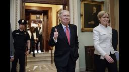 Senate Majority Leader Mitch McConnell of Ky. signals a thumbs-up as he leaves the Senate chamber on Capitol Hill in Washington, Thursday, April 6, 2017, after he led the GOP majority to change Senate rules and lower the vote threshold for Supreme Court nominees from 60 votes to a simple majority in order to advance Neil Gorsuch to a confirmation vote. (AP Photo/J. Scott Applewhite)