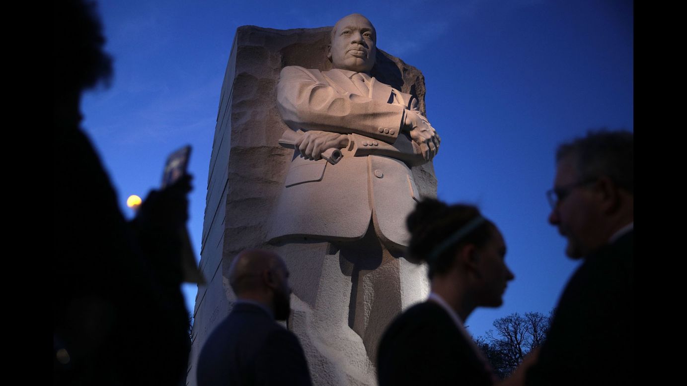 People participate in a candlelight vigil at the Martin Luther King Jr. Memorial in Washington on Tuesday, April 4. The civil-rights leader was assassinated 49 years ago. 