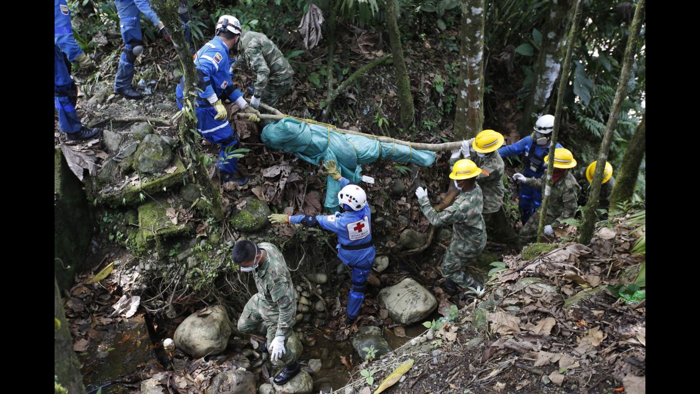 Colombian soldiers and members of the Red Cross recover a body Monday, April 3, after <a href="http://www.cnn.com/2017/04/02/americas/colombia-mudslide/" target="_blank">a deadly mudslide</a> in Mocoa, Colombia. Torrential rains caused three rivers to overflow, sending a torrent of mud surging through the city.