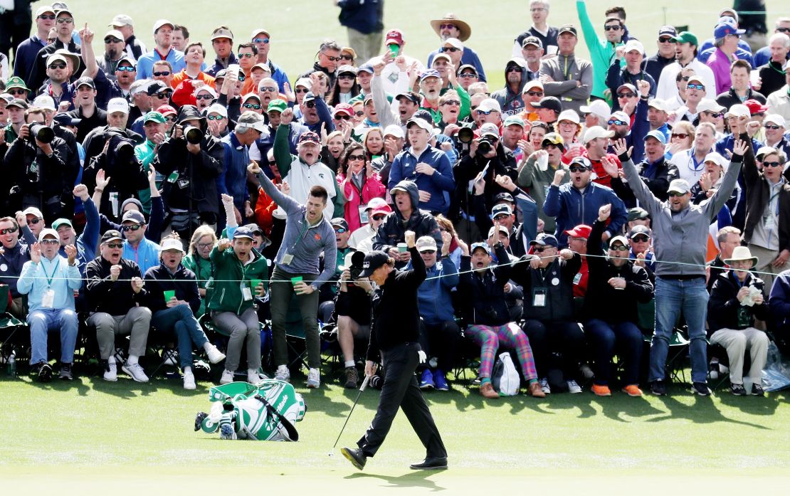 Phil Mickelson drained a long putt for an eagle two on the second hole Thursday.