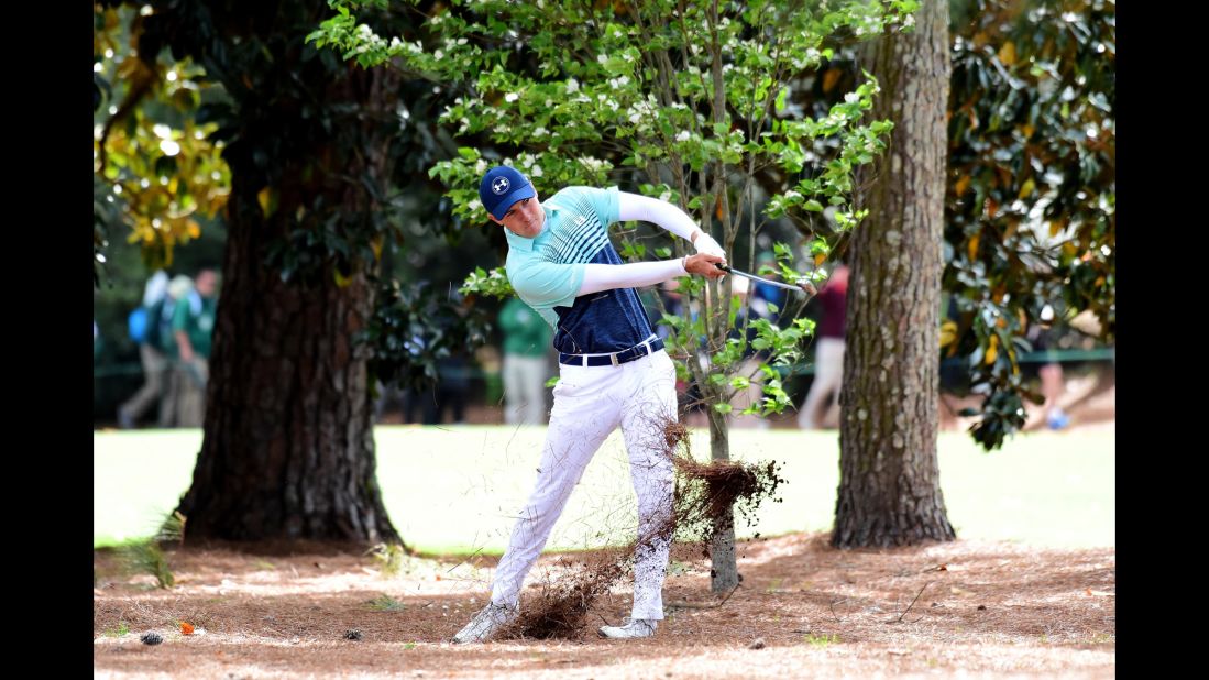 Jordan Spieth plays his second shot on the 18th hole Thursday. Spieth, the Masters winner in 2015, shot a 3-over 75.
