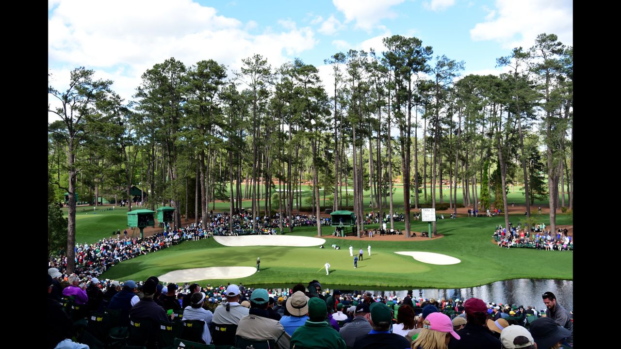 The crowd watches Jason Dufner, Ernie Els and Bernd Wiesberger play the 16th hole on Thursday.