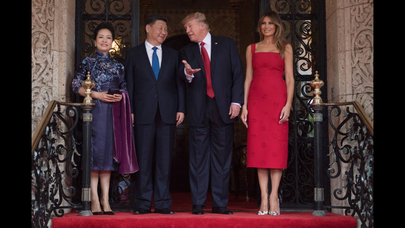 US President Donald Trump talks to Chinese President Xi Jinping at Trump's Mar-a-Lago estate in Florida on Thursday, April 6. They are accompanied by their wives, Peng Liyuan and Melania Trump.