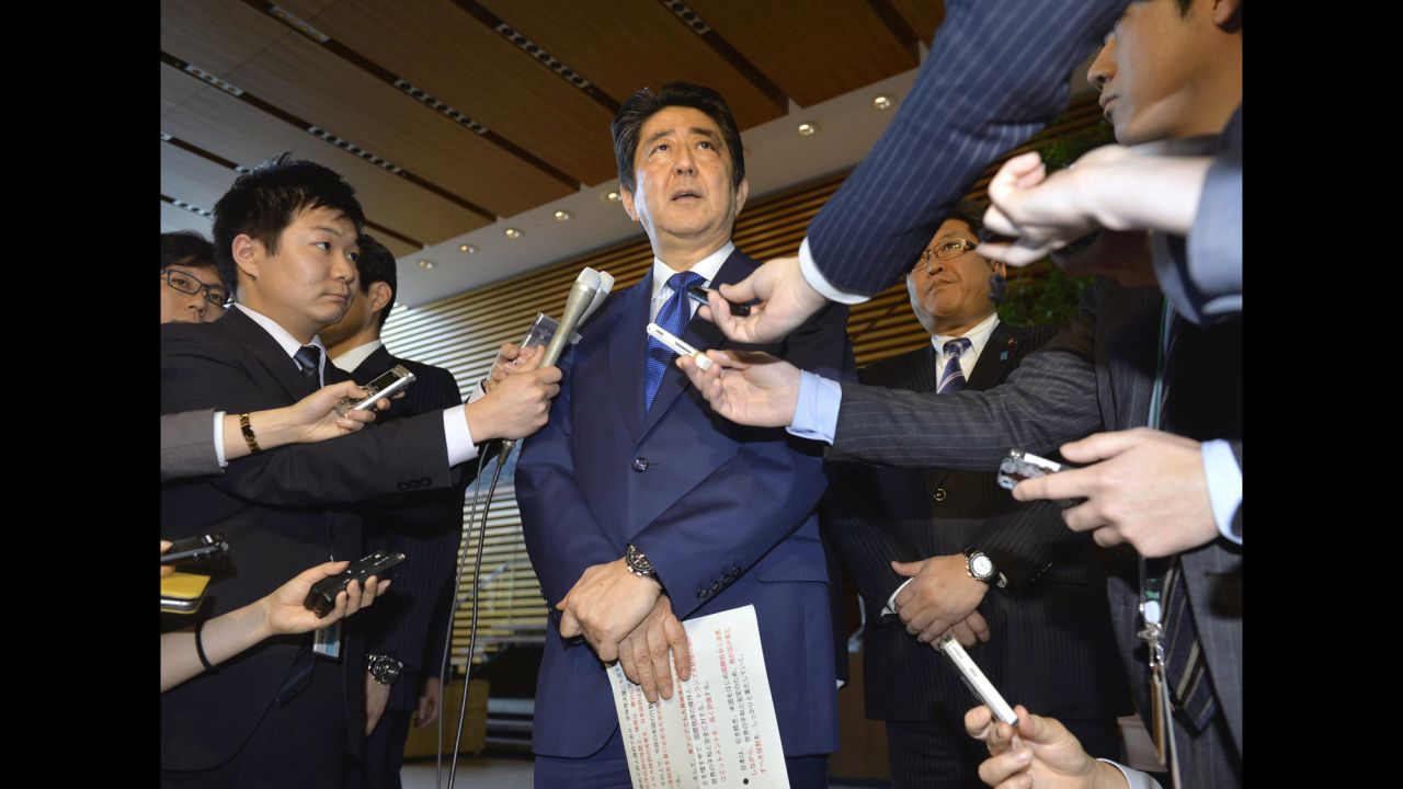 Japanese Prime Minister Shinzo Abe speaks to reporters in Tokyo. "The Japanese government supports the US government's resolve that it will never tolerate the spread and use of chemical weapons," he said.