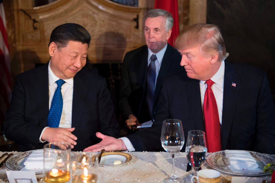 US President Donald Trump (R) and Chinese President Xi Jinping (L) prepare to shake hands during dinner at the Mar-a-Lago estate in West Palm Beach, Florida, on April 6, 2017. 