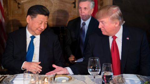 US President Donald Trump and Chinese President Xi Jinping prepare to shake hands during dinner at the Mar-a-Lago estate in West Palm Beach, Florida, on April 6, 2017. 