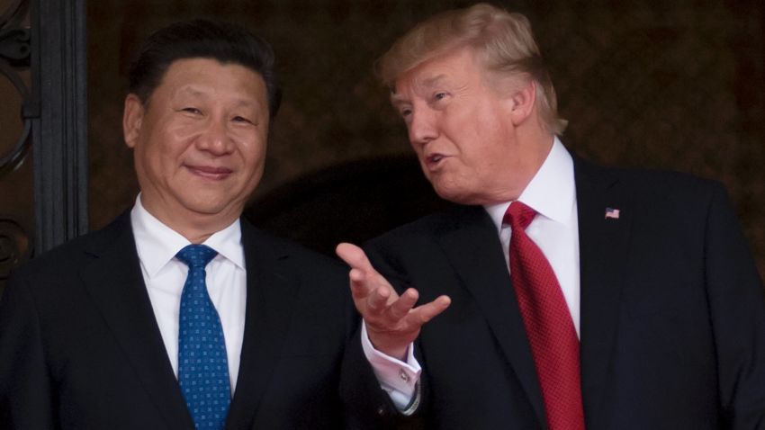 US President Donald Trump (R) welcomes Chinese President Xi Jinping (L) to the Mar-a-Lago estate in West Palm Beach, Florida, on April 6, 2017. / AFP PHOTO / JIM WATSON        (Photo credit should read JIM WATSON/AFP/Getty Images)