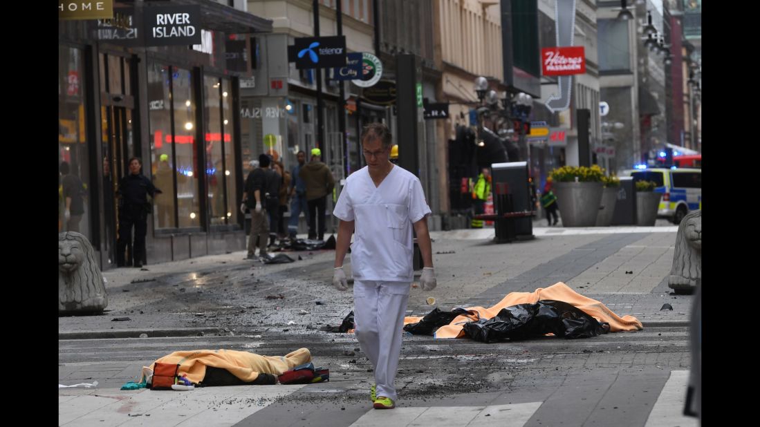 A medical responder moves through the scene of the attack.