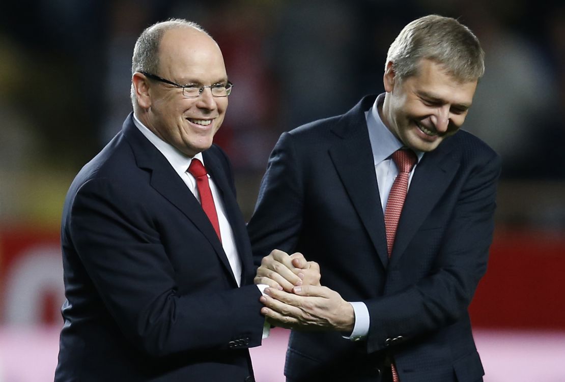 Prince's Albert II of Monaco (L) shakes hands with Monaco's Russian president Dmitry Rybolovlev (R) prior to a Ligue 1 match.