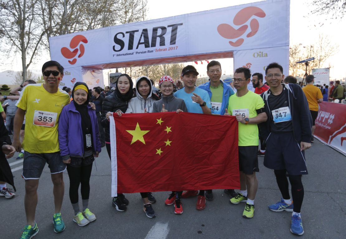 Chinese participants attend the first international Tehran marathon at Azadi Square in Tehran on April 7, 2017.