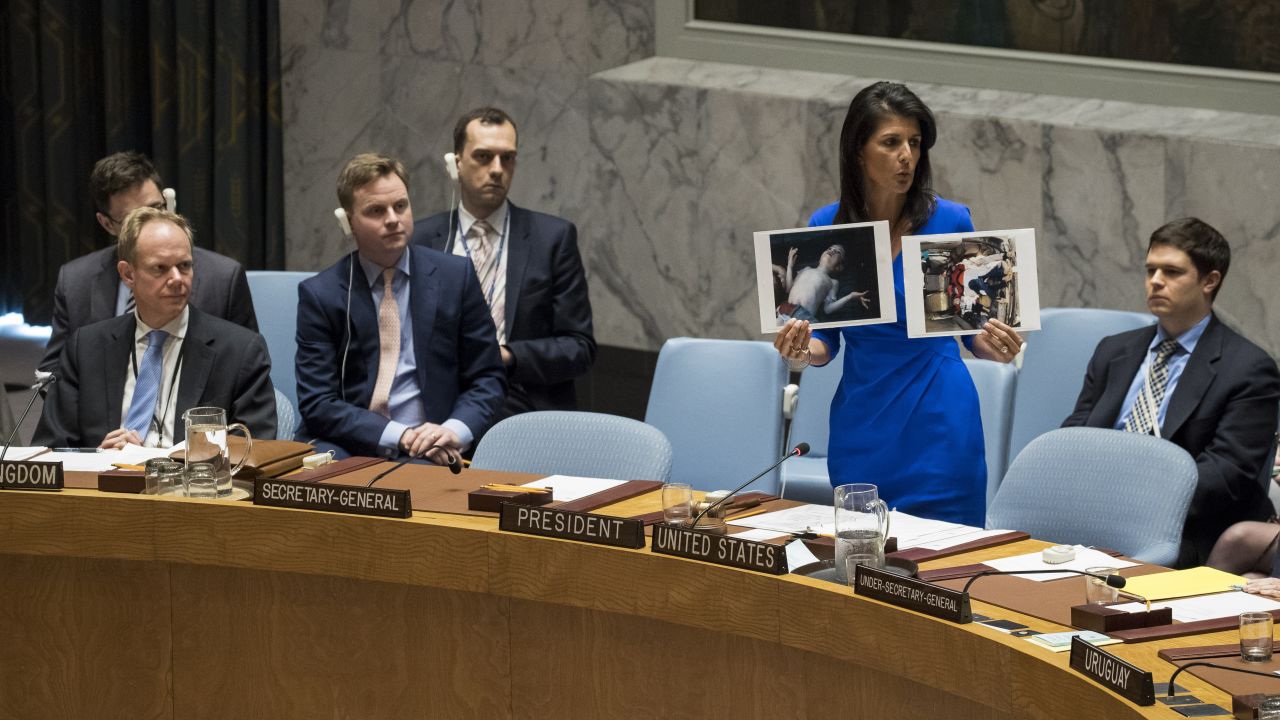 NEW YORK, NY - APRIL 5: U.S. Ambassador to the United Nations Nikki Haley holds up photos of victims of the Syrian chemical attack during a meeting of the United Nations Security Council at U.N. headquarters, April 5, 2017 in New York City. The Security Council is holding emergency talks on Wednesday following the worst use of chemical weapons in Syria since the Ghouta attack in 2013. (Photo by Drew Angerer/Getty Images)