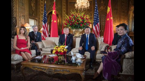 President Donald Trump and first lady Melania Trump pose with Chinese President Xi Jinping and his wife Peng Liyuan upon their arrival to the Mar-a-Lago estate in West Palm Beach, Florida, on April 6, 2017.