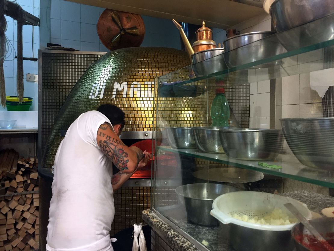Di Matteo's pizza oven in action.