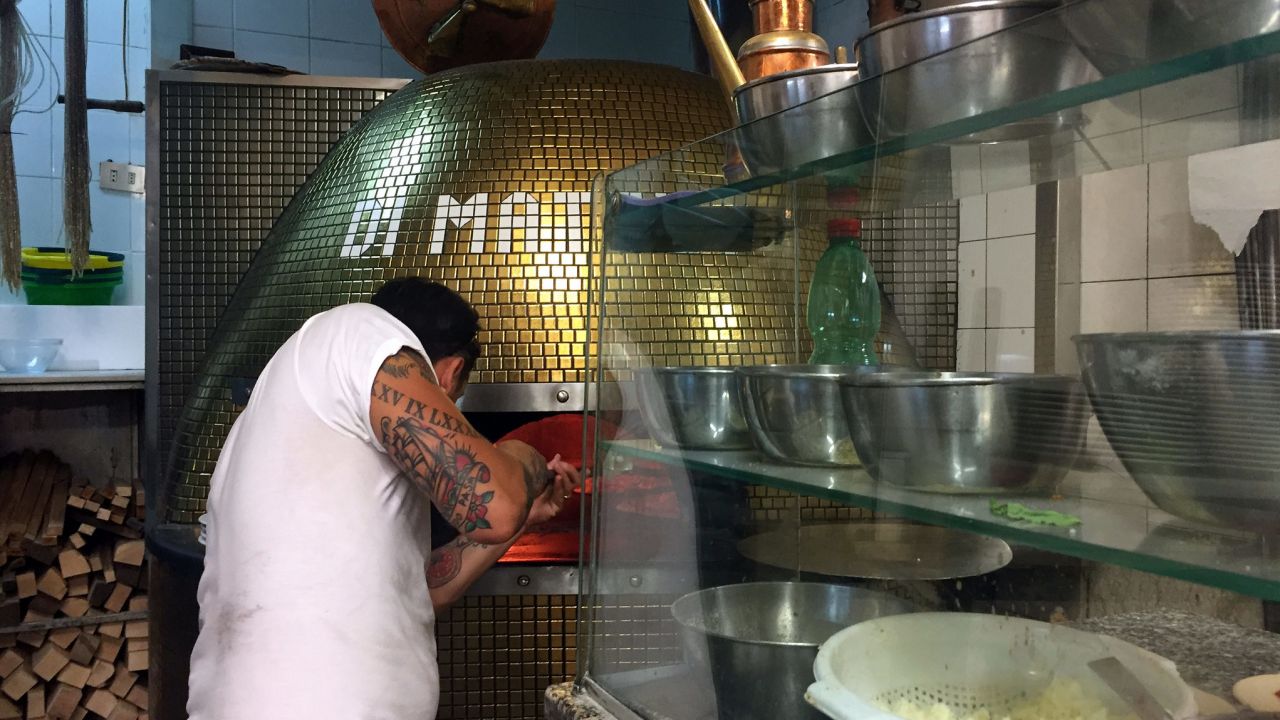 Di Matteo's pizza oven in action.