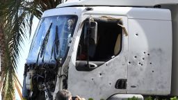 A picture taken on July 15, 2016 shows the truck, riddled with bullets, that was driven by a man through a crowd celebrating Bastille Day being towed away by breakdown lorry in the French Riviera city of Nice. / AFP / BORIS HORVAT        (Photo credit should read BORIS HORVAT/AFP/Getty Images)