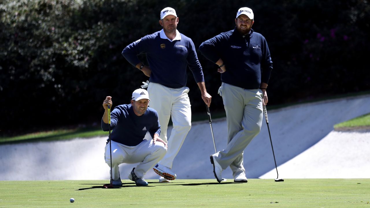 From left, Garcia, Lee Westwood and Shane Lowry wait together on a green.