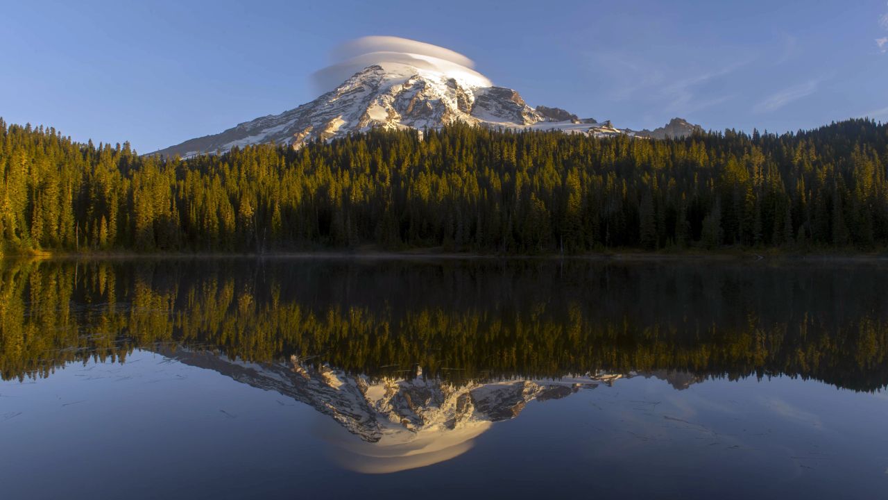 Washington state's highest peak, Mount Rainier, is a glaciated volcano encased in over 35 square miles of snow and ice.