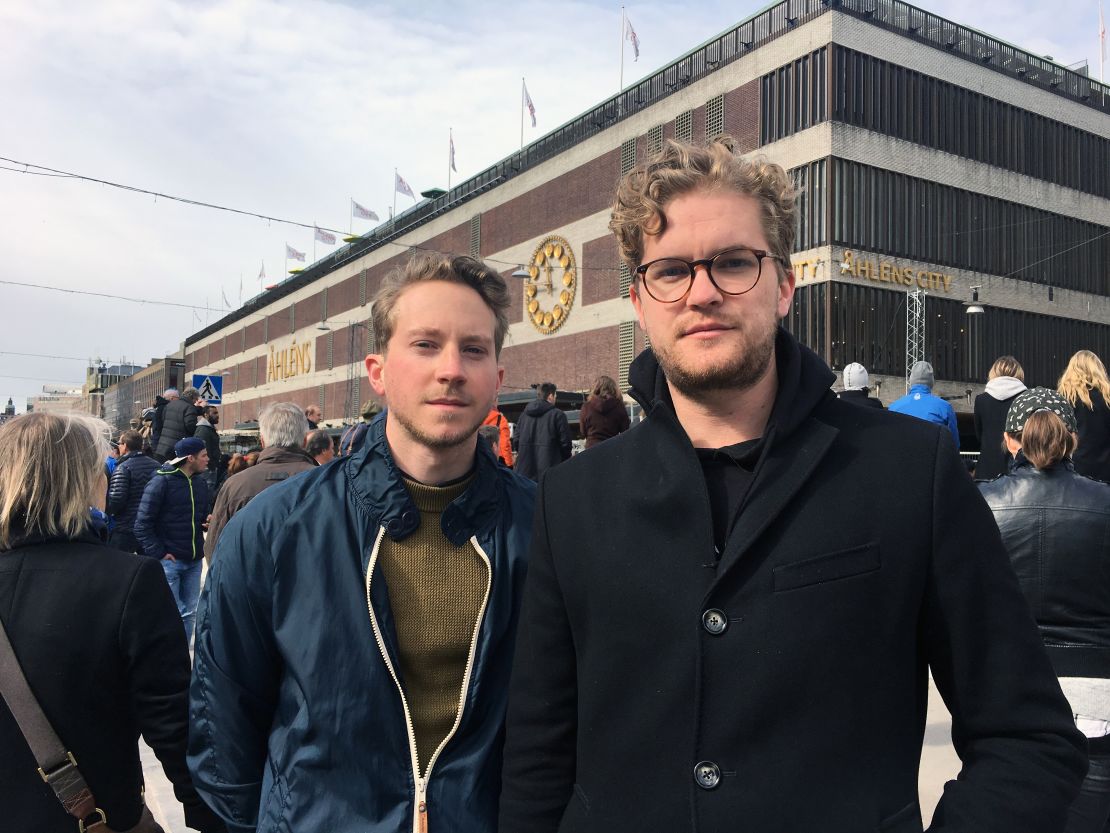 Bjorn Lundvall, 24, (right) with his friend Jesper Johannsson. "I wanted to see this with my own eyes," he says. "I followed the broadcasts yesterday but ... I wanted to get closer to it."