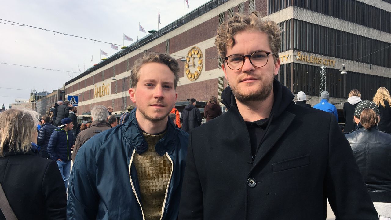 Bjorn Lundvall, 24, (right) with his friend Jesper Johannsson. "I wanted to see this with my own eyes," he says. "I followed the broadcasts yesterday but ... I wanted to get closer to it."