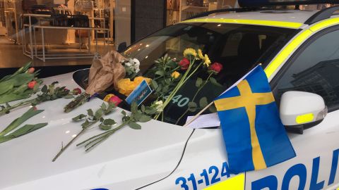 Cards and flowers have been left on police car windshields in the city center, thanking officers for their work.