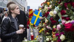 STOCKHOLM, SWEDEN - APRIL 08: A young woman pays her respect at the scene of the terrorist truck attack in downtown Stockholm on April 8, 2017 in Stockholm, Sweden. (Photo by Michael Campanella/Getty Images)
