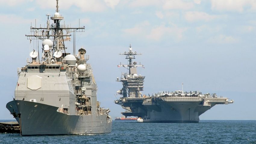 The US aircraft carrier Carl Vinson (R) and the cruiser USS Bunker Hill (L) sit anchored off Manila Bay after arriving on May 15, 2011 for a four-day port of call accompanied by three other warships.  The Carl Vinson is making a port call in the Philippine capital after its crew buried Osama bin Laden's remains in the Arabian Sea   AFP PHOTO / JAY DIRECTO (Photo credit should read JAY DIRECTO/AFP/Getty Images)
