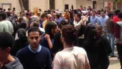 Relatives and onlookers gather outside St. George Coptic church after a bomb attack in the Nile Delta town of Tanta, Egypt, Sunday, April 9, 2017. The attack took place on Palm Sunday, the start of the Holy Week leading up to Easter.