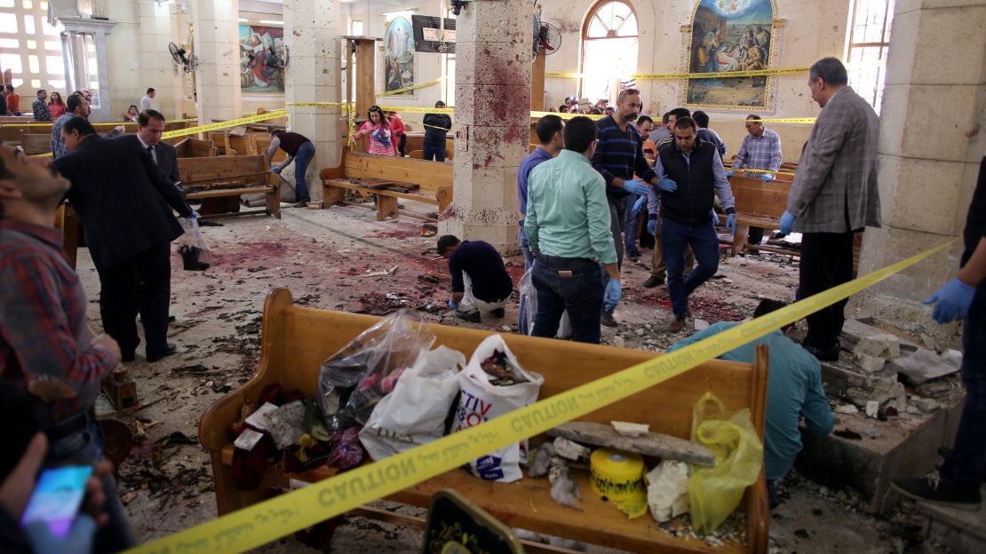 Security personnel investigate the scene of a bomb explosion inside Mar Girgis church in Tanta, Egypt on April 9. 