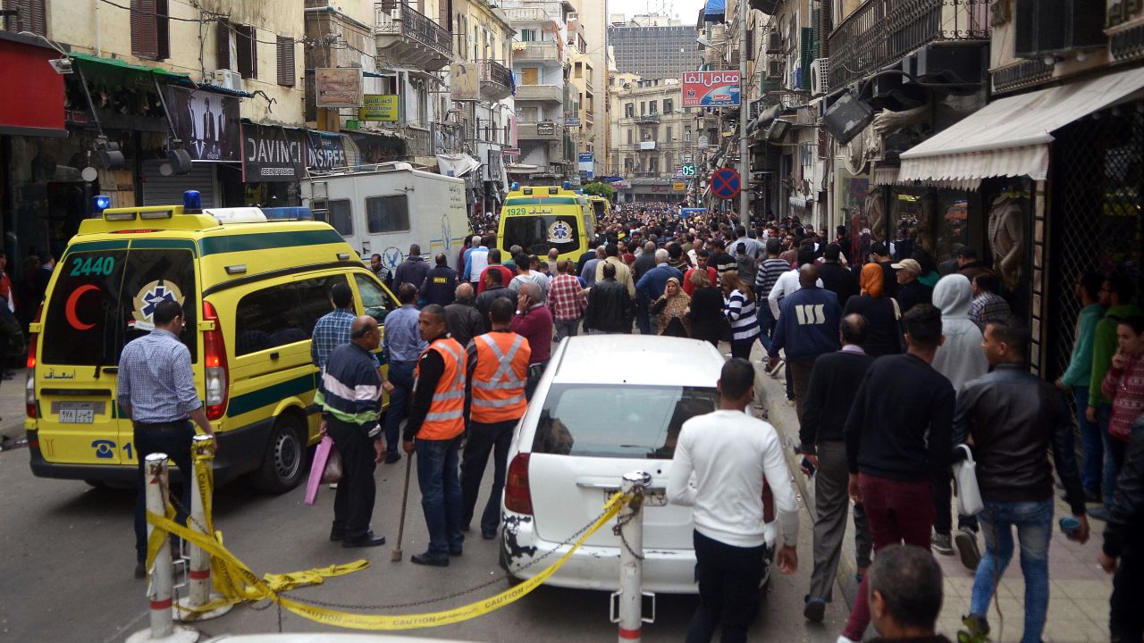 Egyptians gather near a church in Alexandria after a bomb blast struck worshipers.