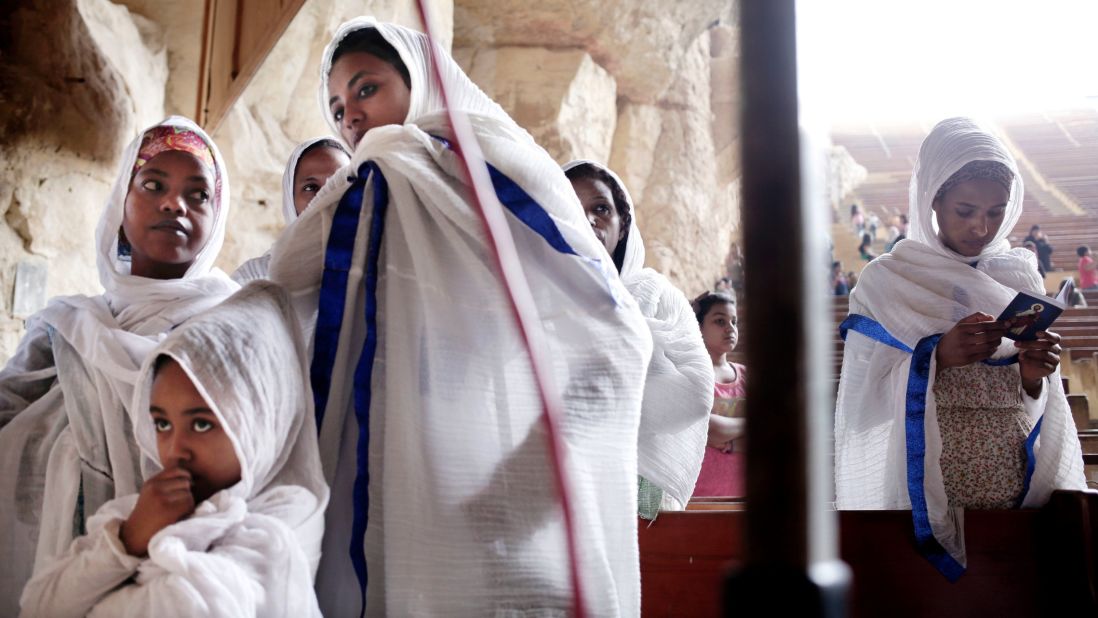 Ethiopians pray during a Palm Sunday Mass inside the St. Samaan Church overlooking Cairo.