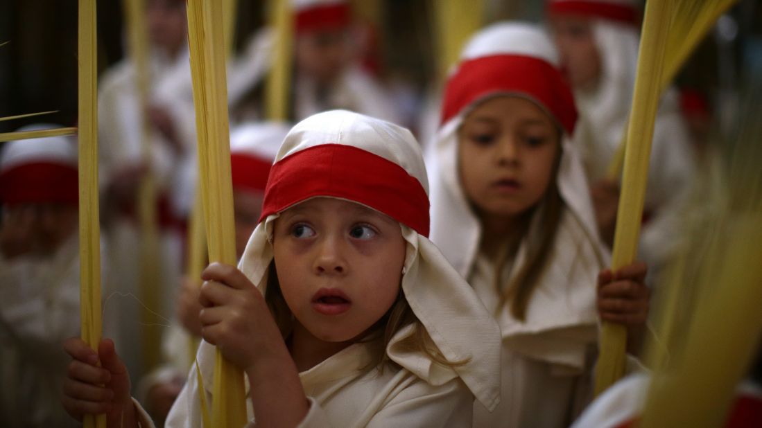 Children take part in a Holy Week procession in Cordoba, Spain, on April 9.