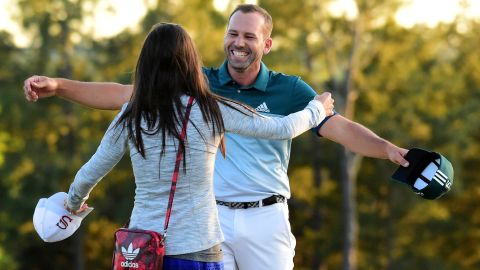 Sergio Garcia of Spain embraces fiancee Angela Akins after defeating Justin Rose 
