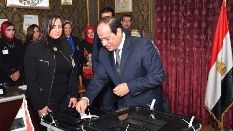 President of Egypt Abdel Fattah el-Sisi casts his vote during parliamentary elections in Cairo on November 22, 2015.