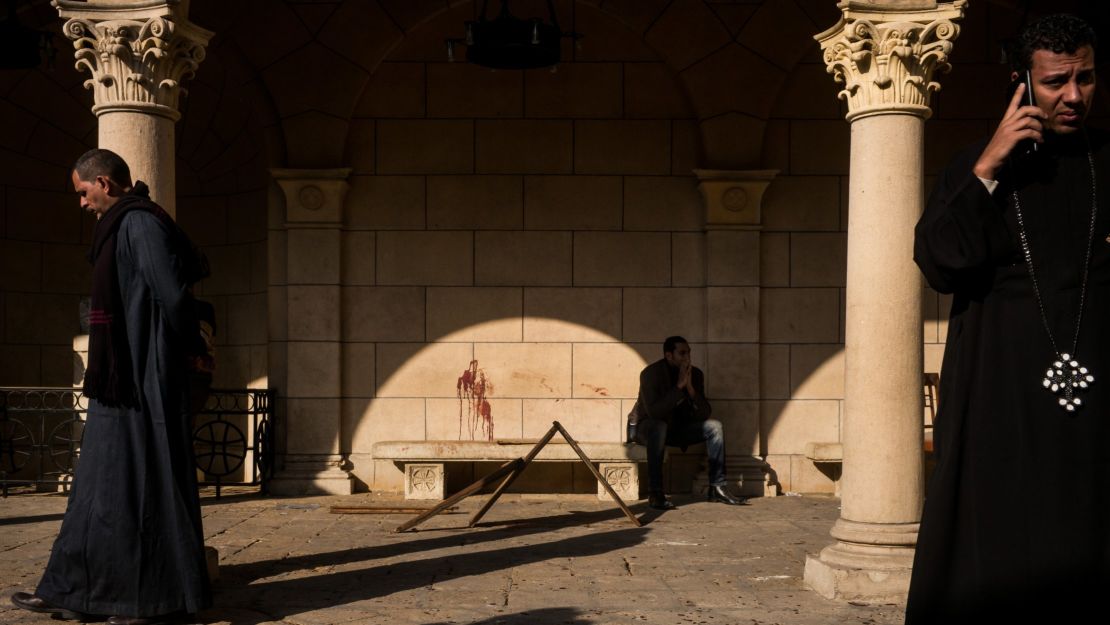 Blood stains the wall in the courtyard at St. Mark's Coptic Orthodox Cathedral of Abbassia on December 11, 2016, in Cairo.