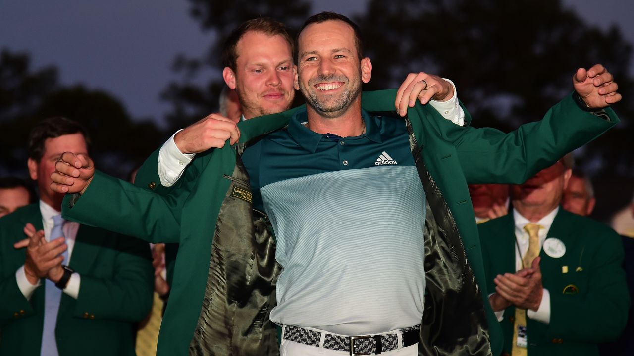 AUGUSTA, GA - APRIL 09: Danny Willett of England presents Sergio Garcia of Spain with the Green Jacket after Garcia won in a playoff during the final round of the 2017 Masters Tournament at Augusta National Golf Club on April 9, 2017 in Augusta, Georgia. (Photo by Harry How/Getty Images)