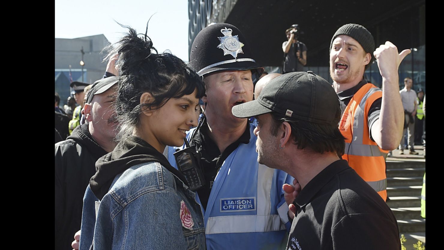 An English Defence League member, right, and a woman identified Saffiyah Khan, are pictured during an EFL rally in Birmingham, England, on Saturday.