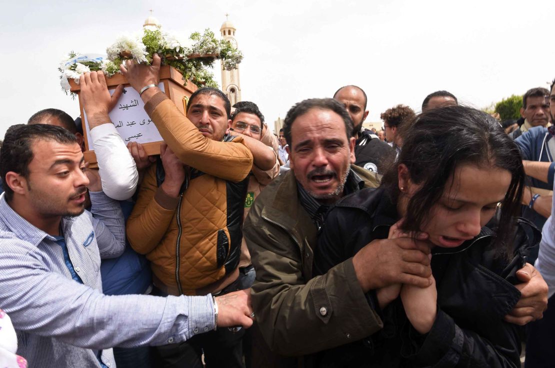 Mourners in Alexandria carry the coffin of one of the blast victims.