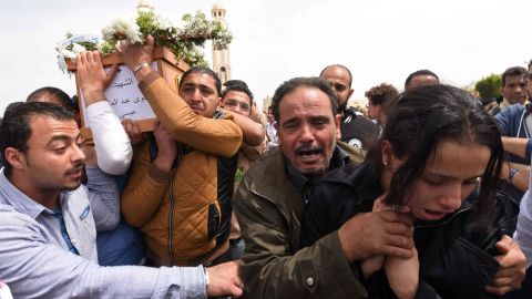 Mourners in Alexandria carry the coffin of one of the blast victims.