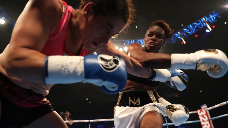 Nicola Adams throws a punch at Virginia Noemi Carcamo during their flyweight boxing bout in Manchester, England, on Saturday, April 8. It was the professional debut for Adams, a two-time Olympic gold medalist from England. She won on points.