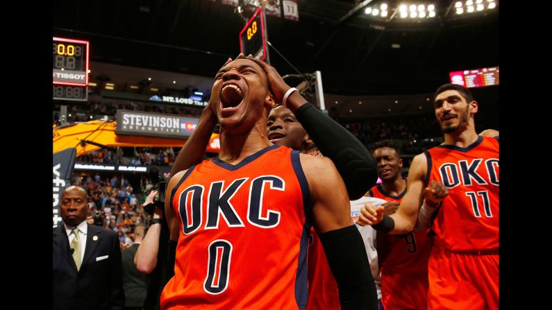 Oklahoma City guard Russell Westbrook (No. 0) celebrates after hitting a buzzer-beating 3-pointer to win at Denver on Sunday, April 9. Westbrook finished with his 42nd triple-double of the season -- an NBA record.
