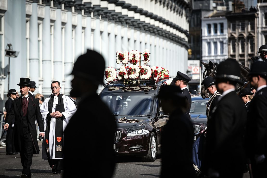 Police line the streets as the funeral cortege of PC Keith Palmer leaves Southwark Cathedral following his funeral service on Monday, April 10 in London.