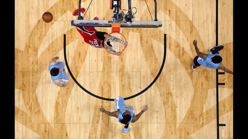 New Orleans forward Anthony Davis throws down a dunk during a home game against Denver on Tuesday, April 4.