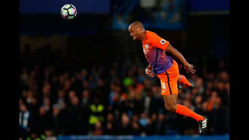 Manchester City captain Vincent Kompany heads the ball during a Premier League match in London on Wednesday, April 5. He was returning from injury to make his first start in months.