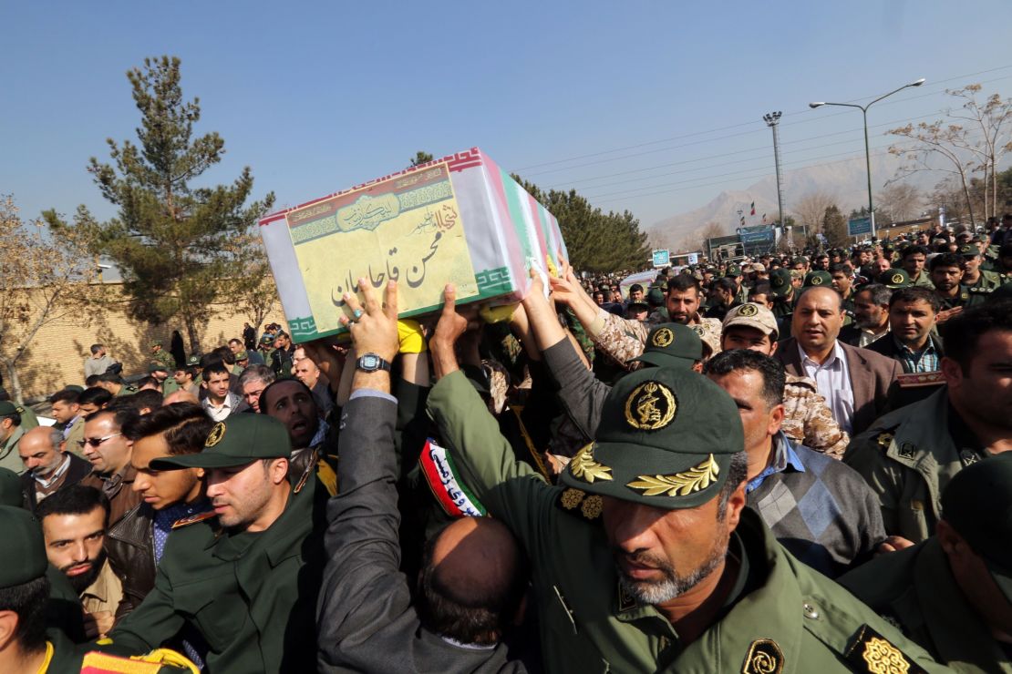 Members of the Iranian Revolutionary Guard carry the caskets of Brigadier General Mohsen Ghajarian and other Iranian "volunteers" killed in Aleppo during their funeral procession in Tehran, in 2016. 
