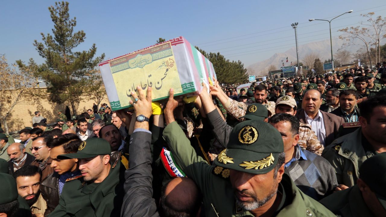 Members of the Iranian Revolutionary Guard carry the caskets of Brigadier General Mohsen Ghajarian and other Iranian "volunteers" killed in Aleppo during their funeral procession in Tehran, in 2016. 
