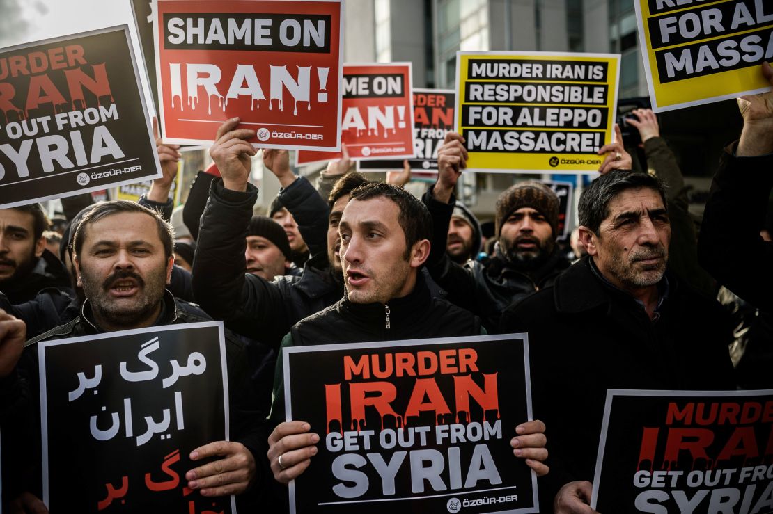 Protesters shout anti-Iran slogans and hold placards in front of the Iranian embassy in Istanbul in December 2016 during a demonstration against Iranian involvement in the siege of Aleppo.