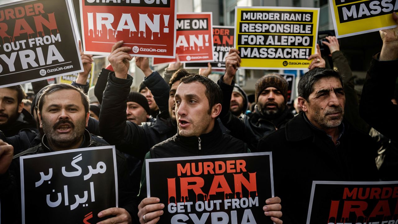 Protesters shout anti-Iran slogans and hold placards in front of the Iranian embassy in Istanbul in December 2016 during a demonstration against Iranian involvement in the siege of Aleppo.