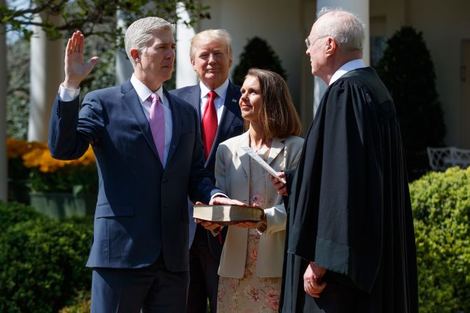 President Donald Trump watches as Supreme Court Justice Anthony Kennedy, right, administers the judicial oath to Neil Gorsuch during <a href="index.php?page=&url=http%3A%2F%2Fwww.cnn.com%2F2017%2F04%2F10%2Fpolitics%2Fneil-gorsuch-trump%2F" target="_blank">a White House ceremony</a> on Monday, April 10. Gorsuch was chosen by Trump to replace Supreme Court Justice Antonin Scalia, who died in 2016. Holding the Bible is Gorsuch's wife, Marie Louise.